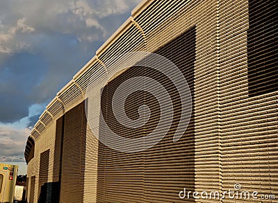 soundproof wall made of concrete porous ribbed material. fence of brown Stock Photo
