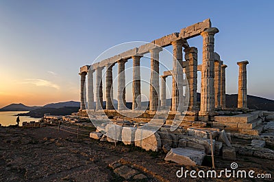 Sounion, Attica / Greece: Colorful sunset at Cape Sounion and the ruins of the temple of Poseidon Stock Photo