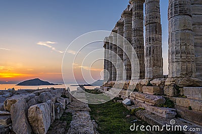 Sounion, Attica / Greece: Colorful sunset at Cape Sounion and the ruins of the temple of Poseidon Stock Photo