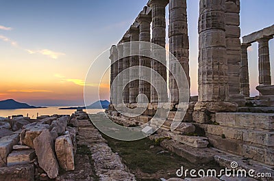 Sounion, Attica / Greece: Colorful sunset at Cape Sounion with the Temple of Poseidon. God of the sea, earthquakes Stock Photo