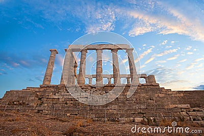 Sounion, Temple of Poseidon in Greece on clouds sky background Stock Photo