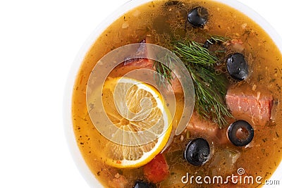 soup with meat, olives, lemon, seasonings and spices. isolated Russian Solyanka, homemade food. Top view Stock Photo