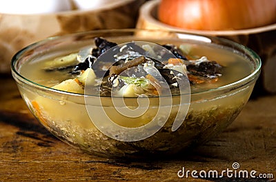 Soup mushrooms glass bowl spoon Stock Photo