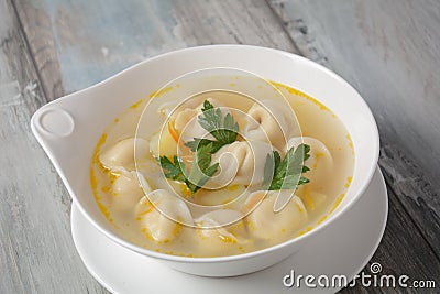 Soup with pelmeni russian dumplings. Stock Photo