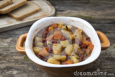 soup with potatoes, onions, carrots and beans Stock Photo