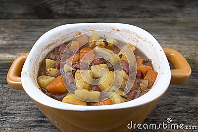 soup with potatoes, onions, carrots and beans Stock Photo