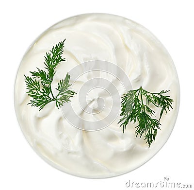 Sour cream in small round plate with dill twig Stock Photo