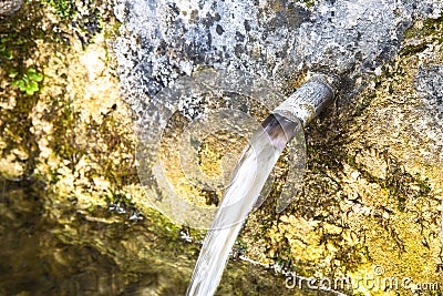 Source of drinking water comes from a mountain - image with copy space Stock Photo