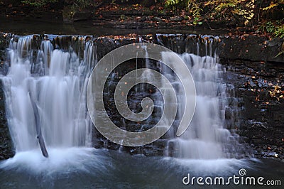 Source Vistula. Crystalline stream, clean water and waterfall. Rocks. Stock Photo