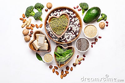 Sources of vegetable protein laid out in the shape of a heart on a white background Stock Photo