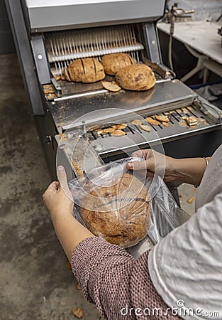 Sourdough bread slicing Stock Photo