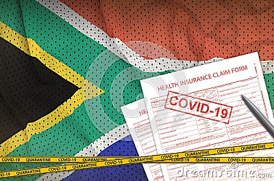 South Africa flag and Health insurance claim form with covid-19 stamp. Coronavirus or 2019-nCov virus concept Stock Photo