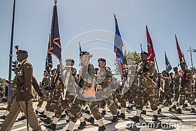 South African Army marches in formation, carrying rifles and flags Editorial Stock Photo