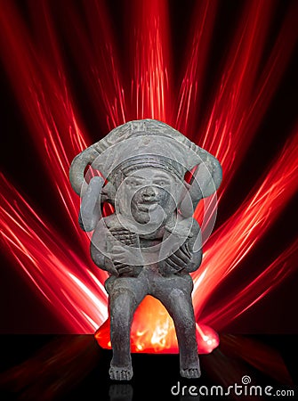 South-American clay Deity. Red neon rays in the background. Editorial Stock Photo