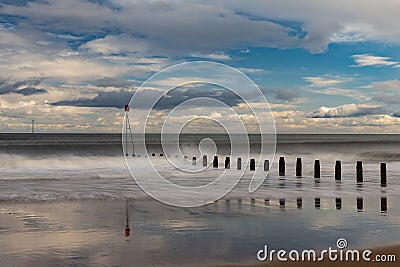 South beach Blyth, wooden groins on a cloudy day Stock Photo