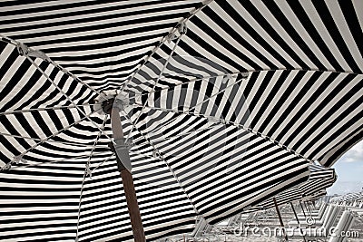 South Beach Miami: white and blue striped umbrellas and sunbeds on the beach. Beach life, vacation, holiday mood Stock Photo