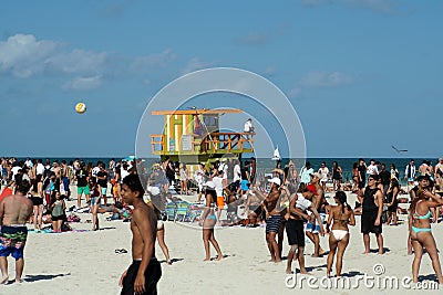 Tourists around a lifeguard stand on South Beach in Miami Editorial Stock Photo