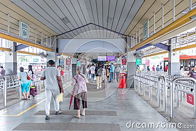 South East Asia / Singapore - Human traffic during off peak hour in a bus interchange. Unidentified people are Editorial Stock Photo