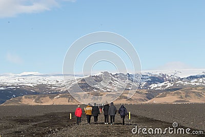 South Iceland 03 March 2018 : Tourist walking to famous landmark the abandoned wreck of a US military plane on Solheimasandur Editorial Stock Photo