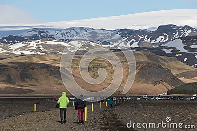 South Iceland Tourist walking to famous landmark the abandoned wreck of a US military plane on Solheimasandur Editorial Stock Photo