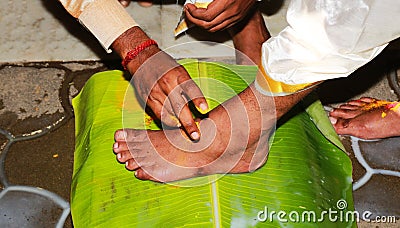 South Indian Hindu Wedding tradition, Groom and Bridal Legs and Hands Ceremonial Stock Photo