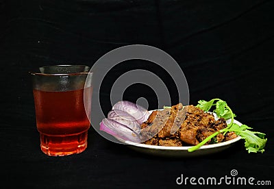 South indian Style Spicy beef fry with black tea Stock Photo