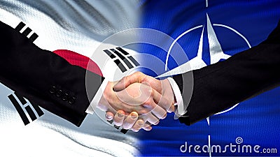 South Korea and NATO handshake, international friendship, flag background Editorial Stock Photo