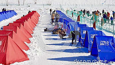 Ice fishing with colorful tents in Trout Festival in South Korea Editorial Stock Photo