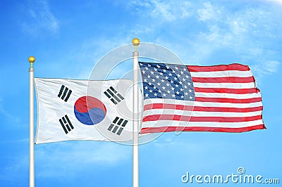 South Korea and United States two flags on flagpoles and blue cloudy sky Stock Photo