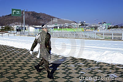 South Korean Soldier walking near the border of North Korea Editorial Stock Photo