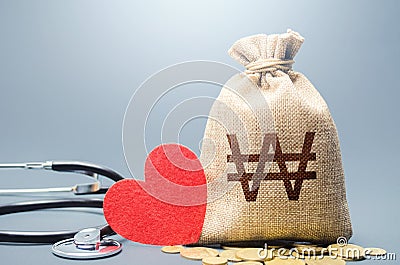 South korean won money bag and stethoscope. Health life insurance financing concept. Subsidies. Funding healthcare system. Stock Photo