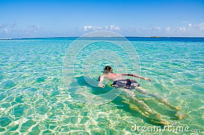 South Water Caye - Small tropical island at Barrier Reef with paradise beach - known for diving, snorkeling and relaxing vacations Stock Photo