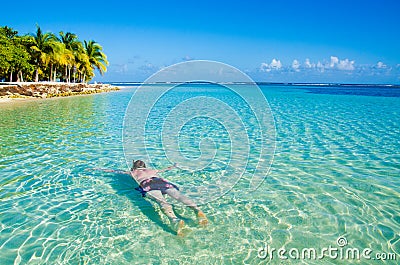 South Water Caye - Small tropical island at Barrier Reef with paradise beach - known for diving, snorkeling and relaxing vacations Stock Photo