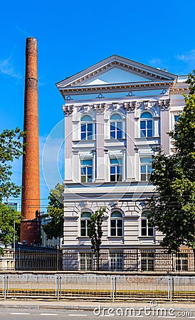 South wing of historic building of Warsaw Polytechnics technical university with vintage chimney in Warsaw, Poland Editorial Stock Photo