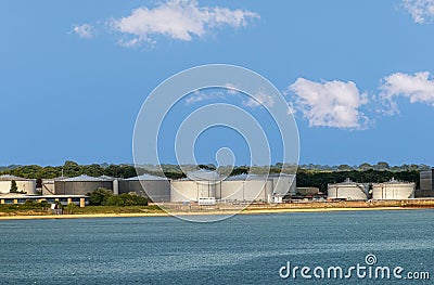 Esso petroleum tanks along East Cowes water, Southampton, England, UK Editorial Stock Photo