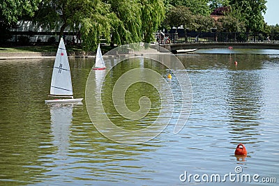 Sailing model yachts on a lake in Southend-on-sea Essex on August 4, 2013. Unidentified Editorial Stock Photo