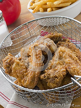 Southern Fried Chicken in a Basket with Fries Stock Photo