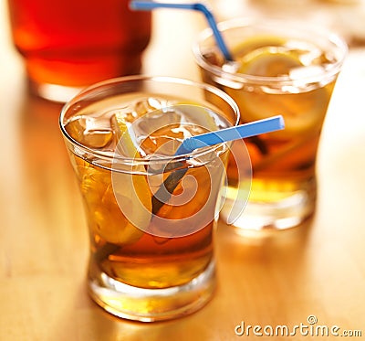 Southern sweet tea with lemon slices and straws Stock Photo