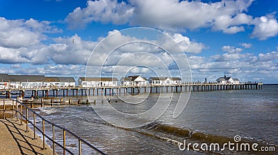 Southwold`s iconic pier against a dramatic sky in Southwold, Suffolk, UK Editorial Stock Photo