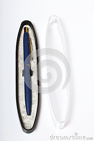 Souvenir ball pen in an open box. A gift for a friend. On a white background. Stock Photo