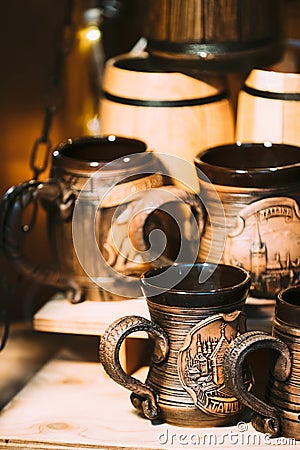Souvenir Cup On Store Shelves. Various Traditional Cups At Folk Market. Souvenir From Tallinn, Estonia Editorial Stock Photo