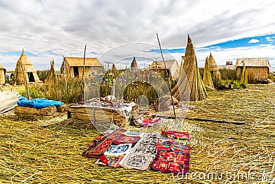 Souvenir on Floating islands Titicaca lake, Peru,South America. Street shop with colorful blanket, scarf, cloth, ponchos Stock Photo