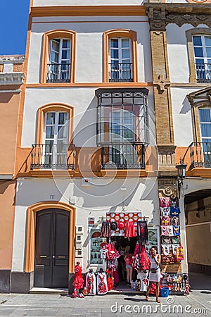 Souvenir shop in a colorful historic house in Sevilla Editorial Stock Photo