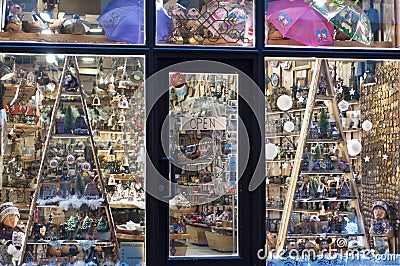 Souvenirs shop window with a sign on the door open in English. Christmas decoration. Night snapshot. Riga. Latvia Stock Photo