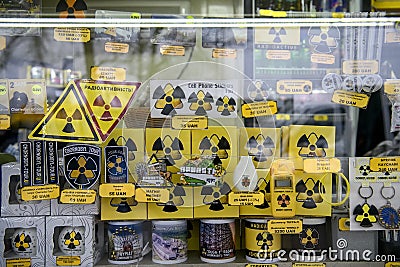 Souvenirs with a symbol of radiation danger in souvenir shop on enter to Chornobyl exclusion zone. Ukraine, 25-12-2019 Editorial Stock Photo