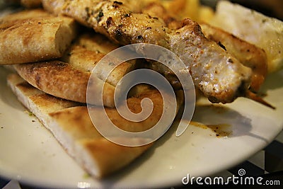 Souvlaki kalamaki with crispy potatoes oregano black peper and lemon Stock Photo