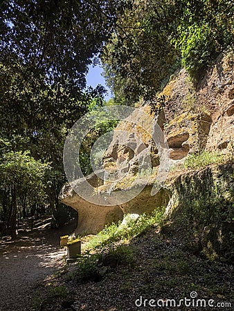 SOVANA, TUSCANY, ITALY - JUNE 16, 2019 - Ancient tomb remains carved into volcanic tuff rock at the Etruscan Necropolis Editorial Stock Photo