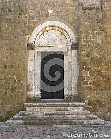 SOVANA, TUSCANY, ITALY - JUNE 16, 2019 - Entrance to the Concattedrale dei Santi Pietro e Paolo aka Duomo Cathedral of Stock Photo