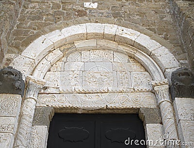 SOVANA, TUSCANY, ITALY - JUNE 16, 2019 - Entrance to the Concattedrale dei Santi Pietro e Paolo aka Duomo Cathedral of Stock Photo