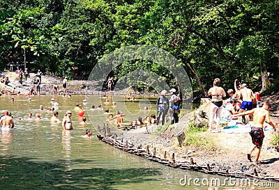 SOVATA, ROMANIA - Jul 19, 2018: tourists bathing in Lake Ursu in Sovata resort Editorial Stock Photo